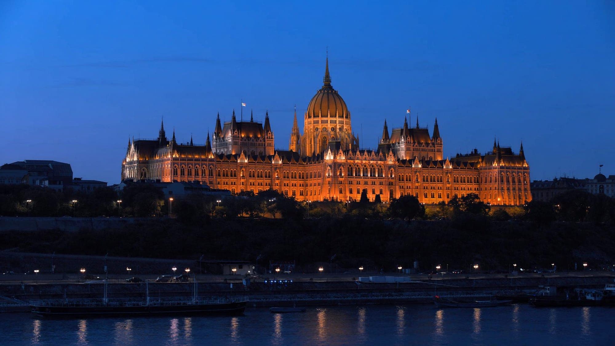 The Hungarian Parliament on the Danube in Budapest at blue hour, seen from the Buda bank