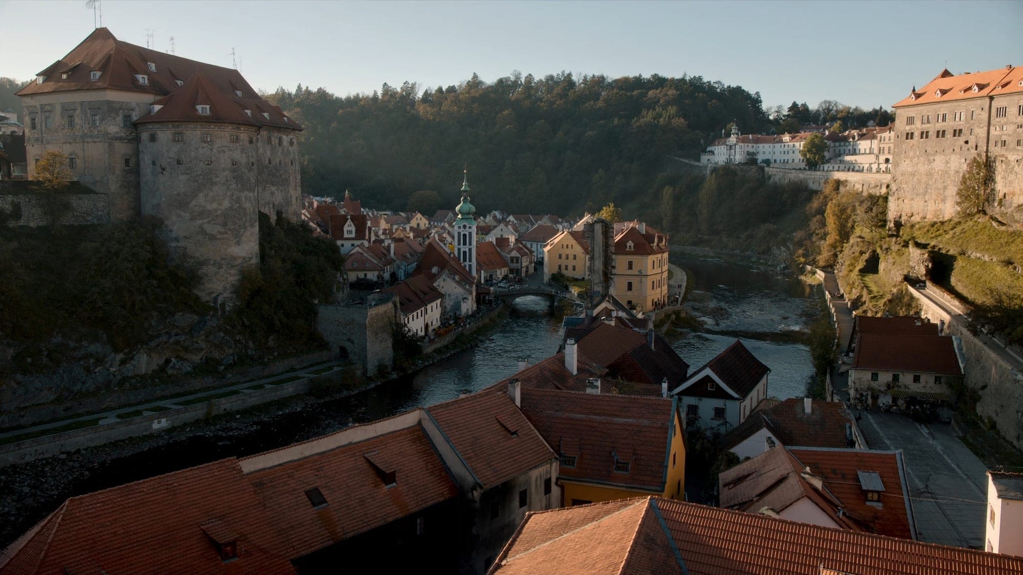 Český Krumlov castle above the bend of the Vltava on a summer evening